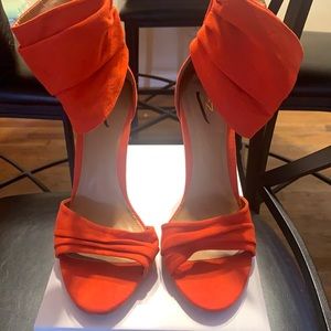 Orange heel with zipper back and ankle strap. Size10